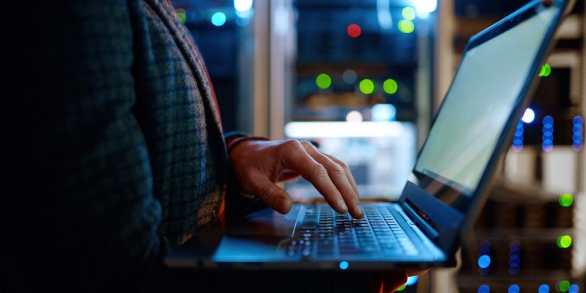 Person holding a laptop