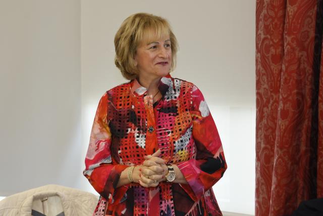 Gail Besner in a conference room