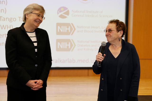 Susan Olesik congratulates Anita Hopper