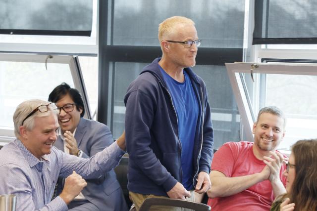 Brent Sohngen with colleagues in a classroom