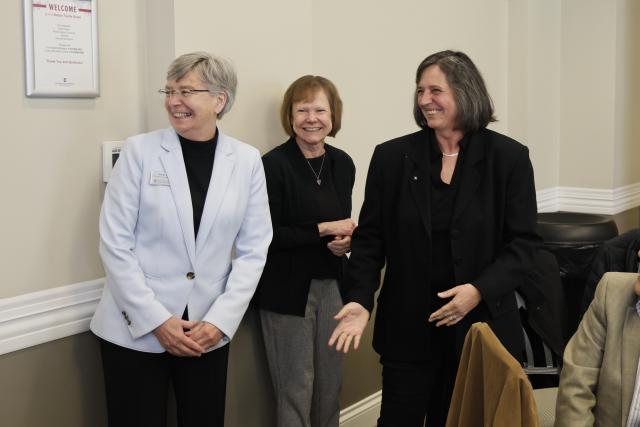 Claudia Turro  laughs with colleagues