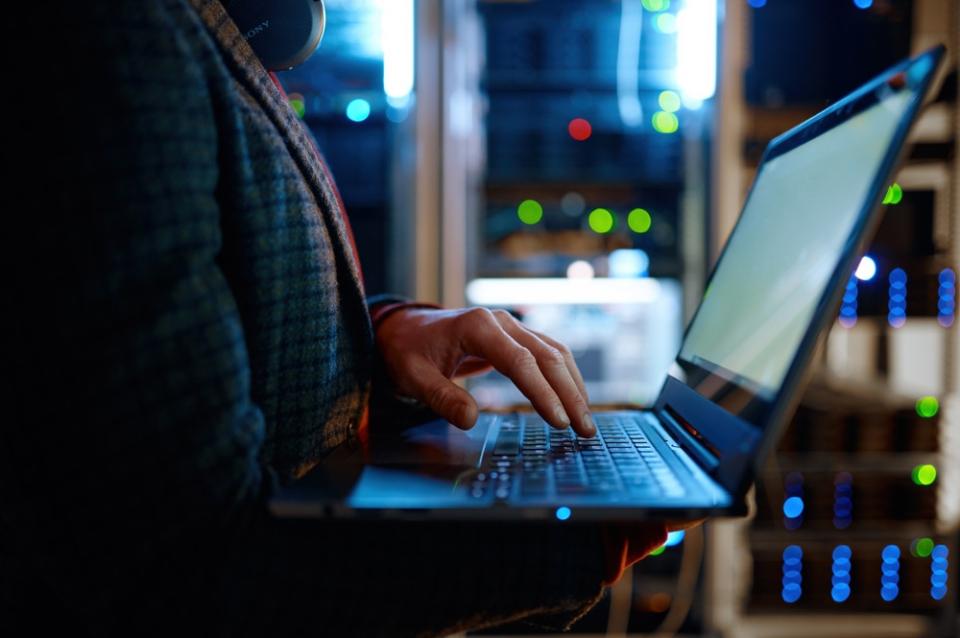 Person holding a laptop