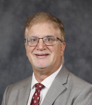 Headshot for Travis Sheffler